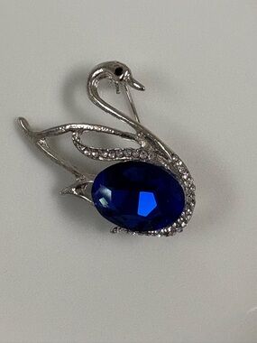 Swan Brooch with Deep Blue Crystal Accent